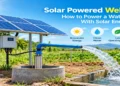 Solar powered well pump with solar panels supplying water to a storage tank